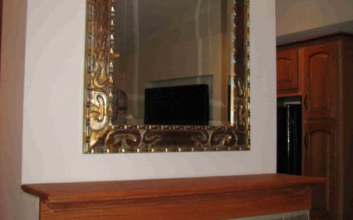 mirror above fireplace